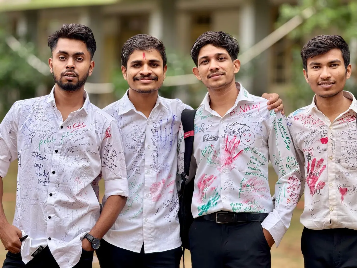A group of college students smiling together on campus